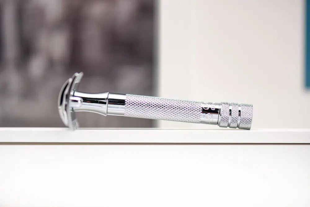 Safety razor on branded background