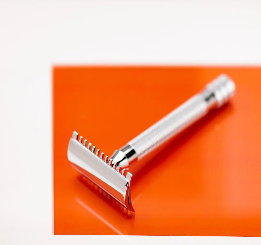 Safety razor on branded background