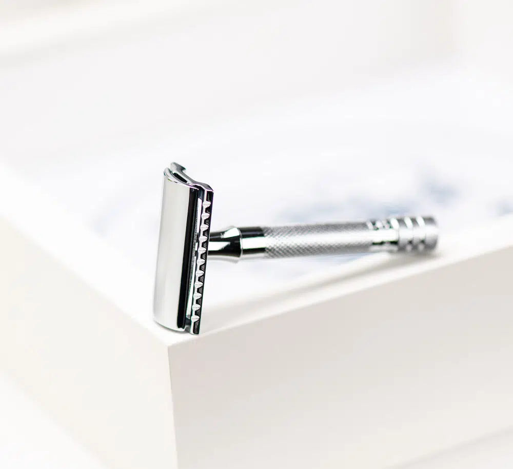 Safety razor on branded background