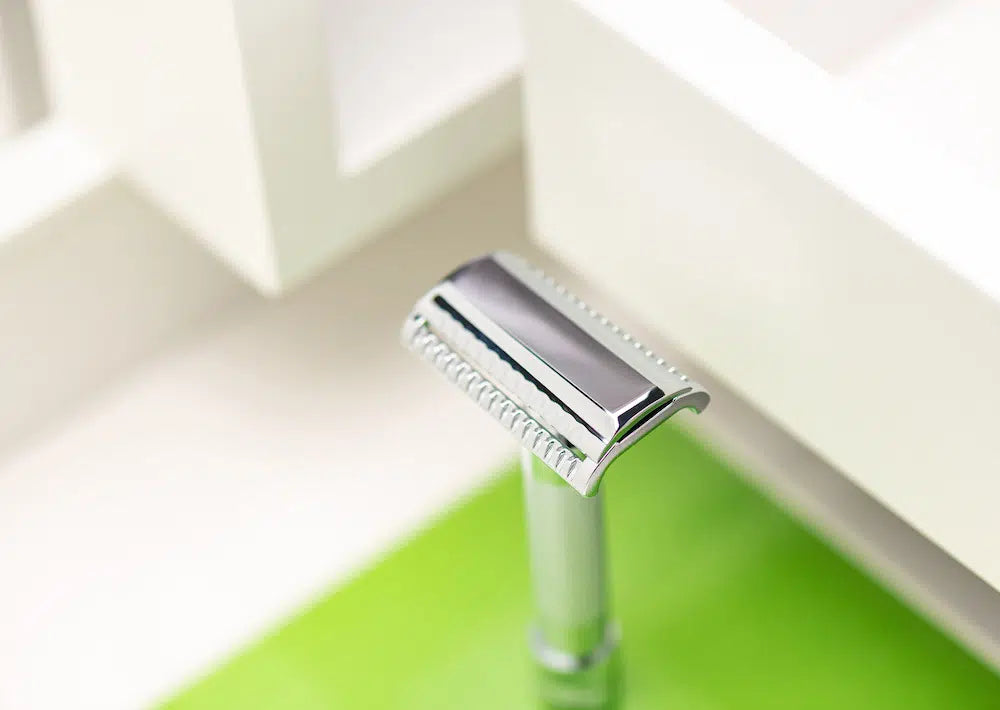 Safety razor on branded background