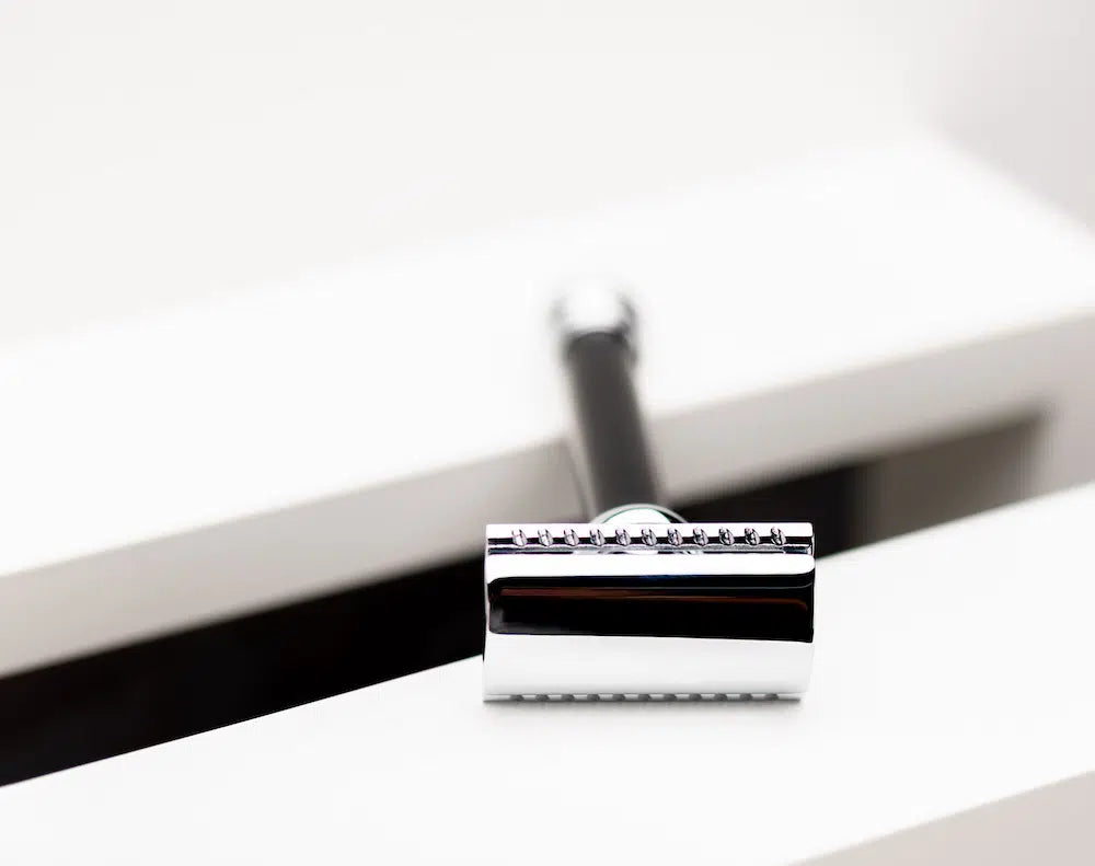 Safety razor on branded background