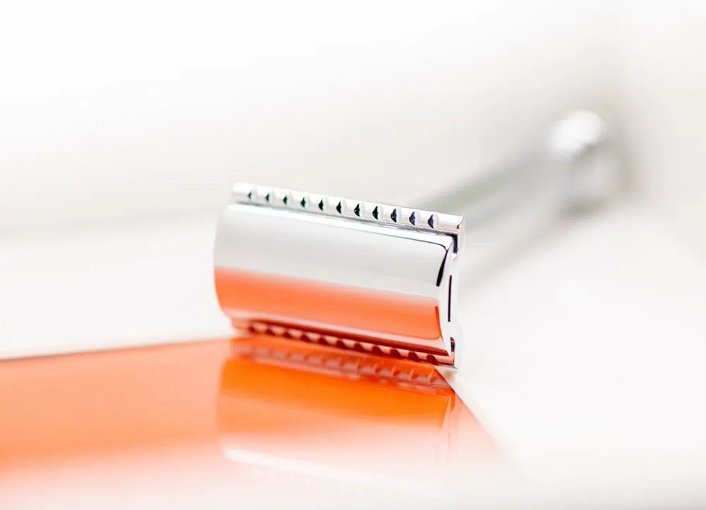 Safety razor on branded background