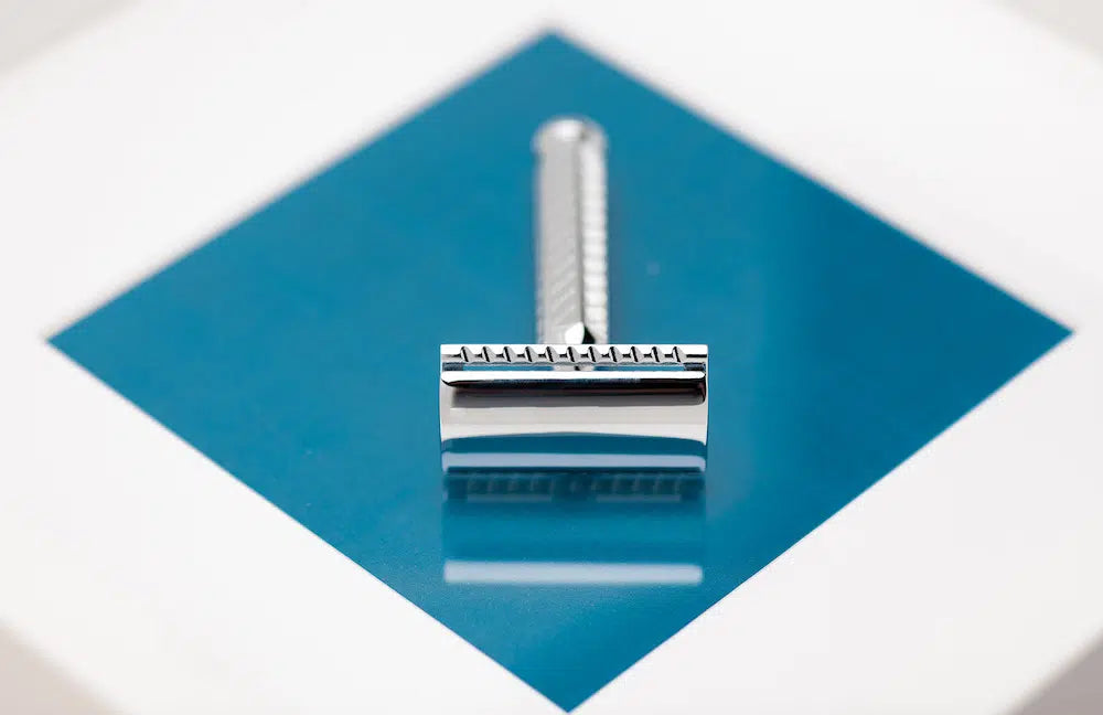 Safety razor on branded background