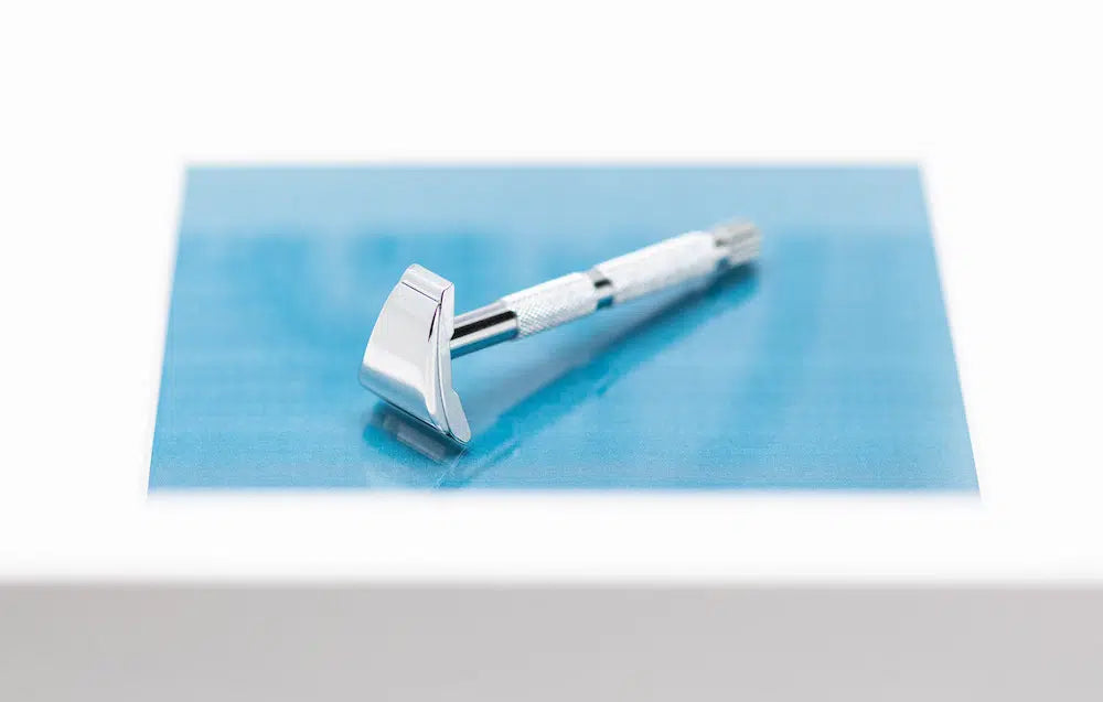Safety razor on branded background
