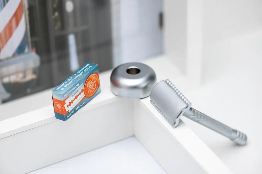 Safety razor on branded background