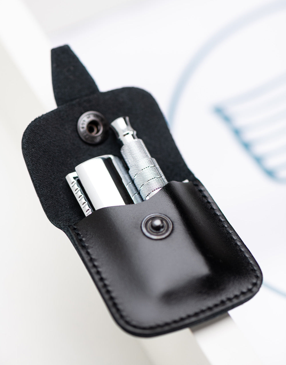 Safety razor on branded background