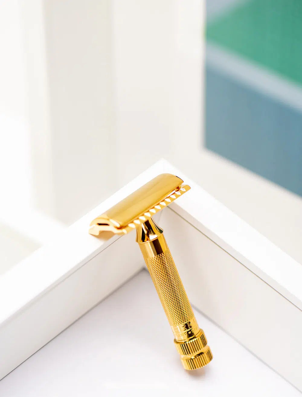 Safety razor on branded background