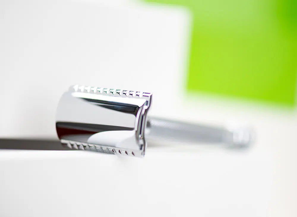 Safety razor on branded background